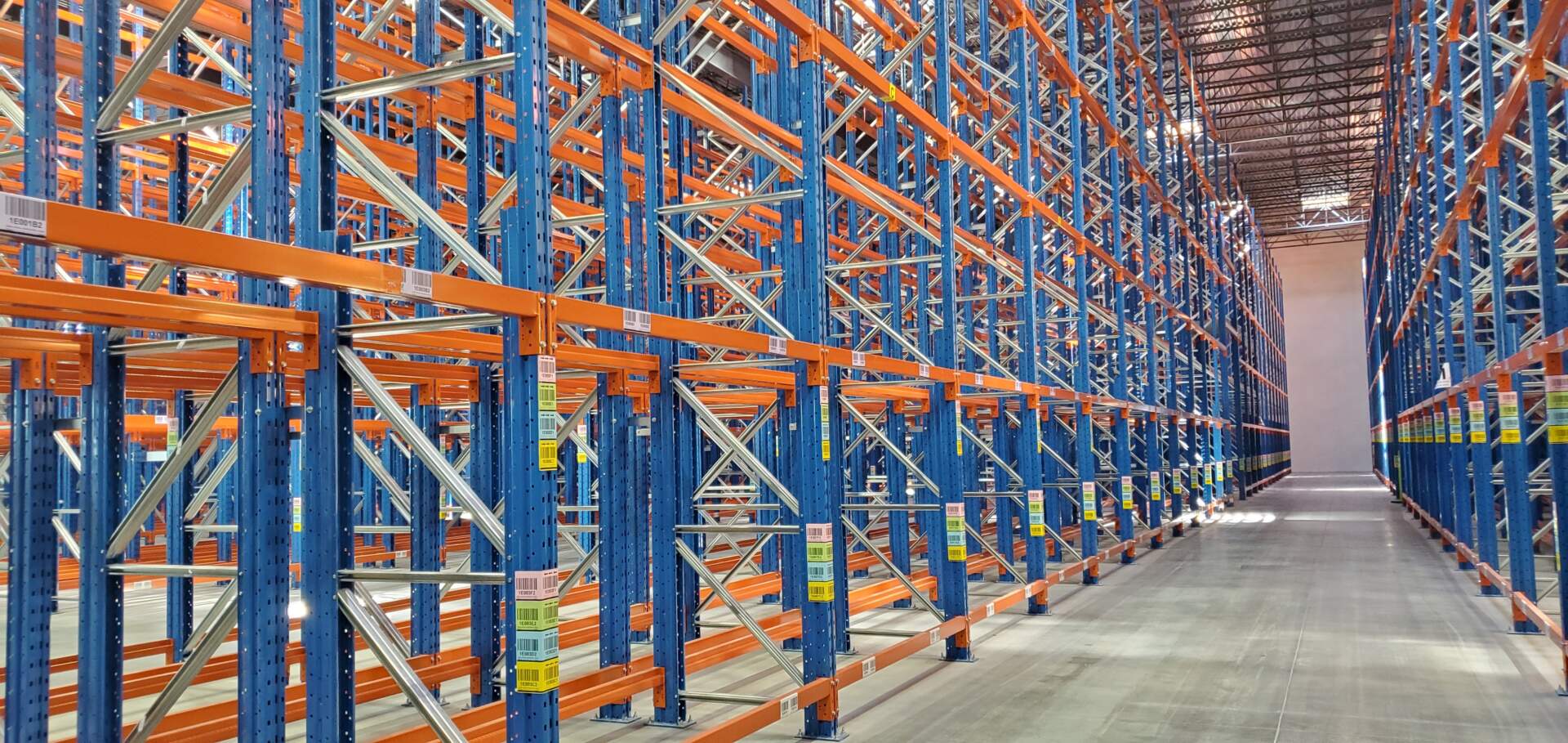 Shelving in a warehouse demonstrates supply chain management.