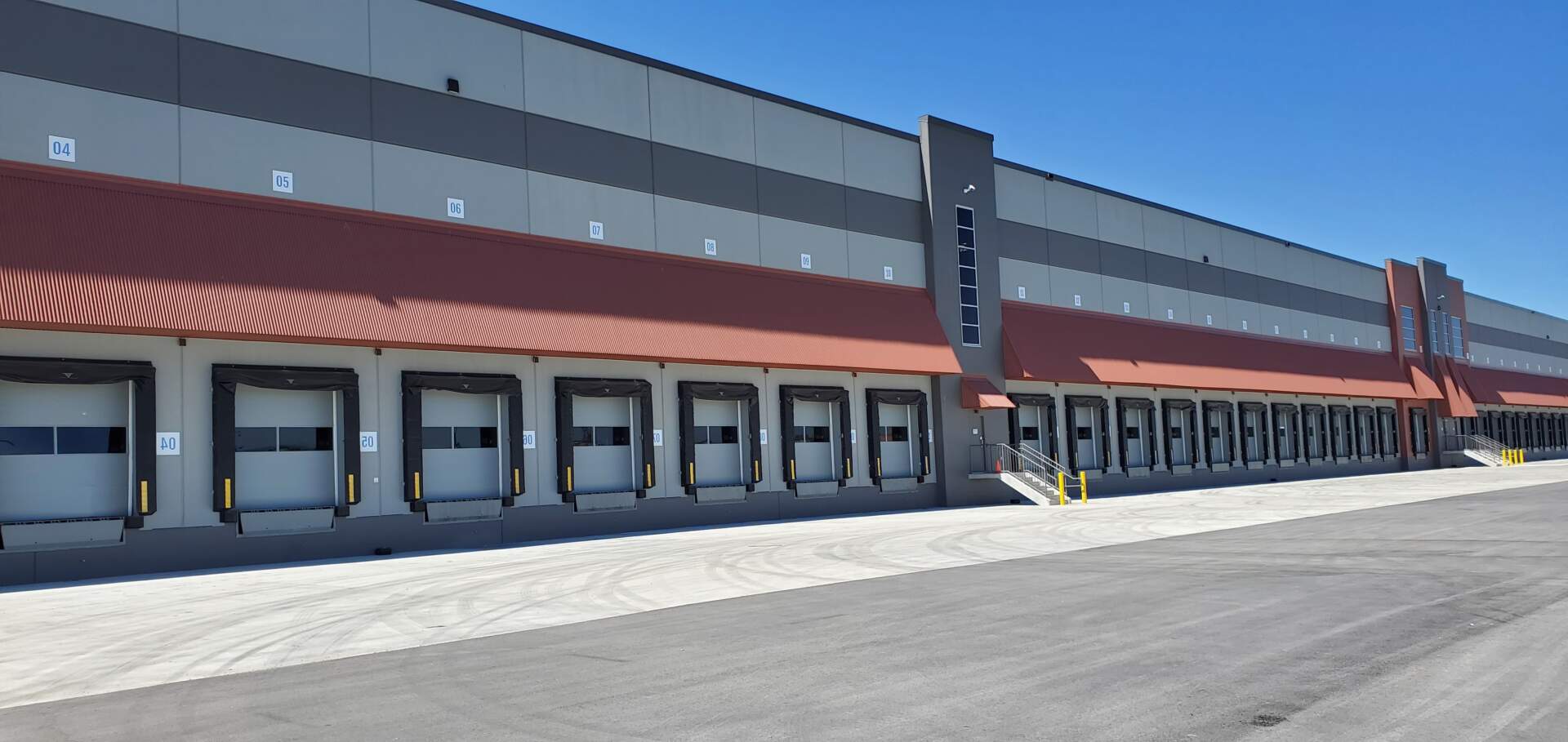 A warehouse is pictured from the outside, demonstrating warehouse management.