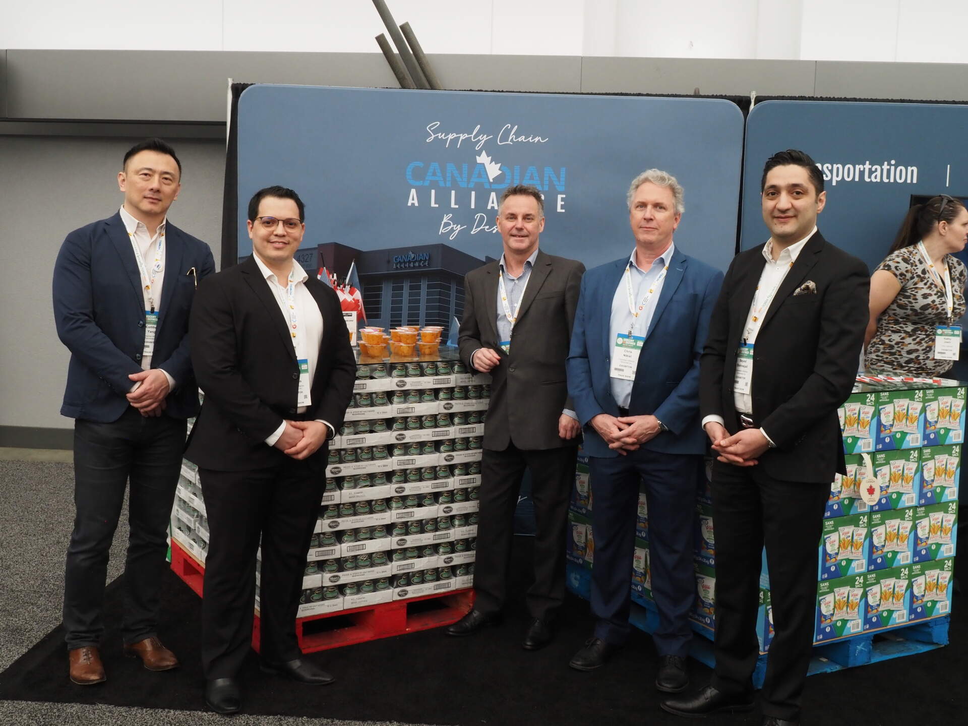 The Canadian Alliance team is photographed at a trade show.